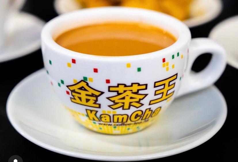 Image describing a KamCha cup with milk tea in it