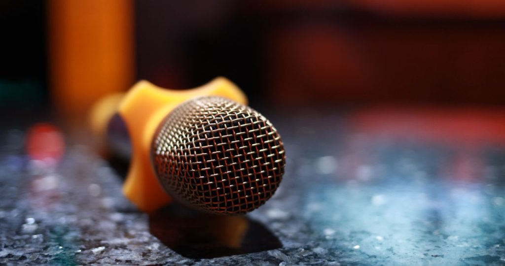 Image describing a microphone on a desk